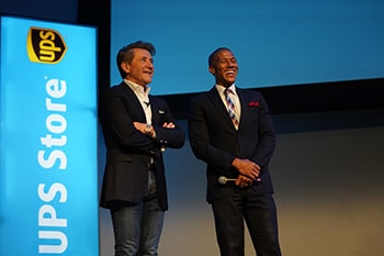Robert Herjavec and The UPS Store employee on-stage