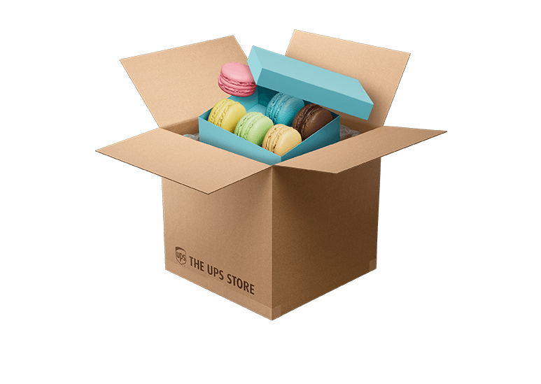 open box with pastel colorec macarons