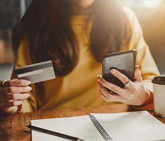 Woman placing an online order with her mobile phone