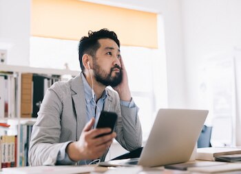 man listening to podcast