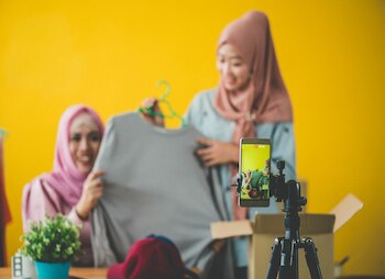 women business owners taking photos of product