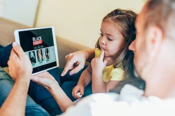 Family seeing sales on tablet