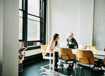 women sitting at conference table