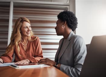 woman business owner shares work experiences with friend