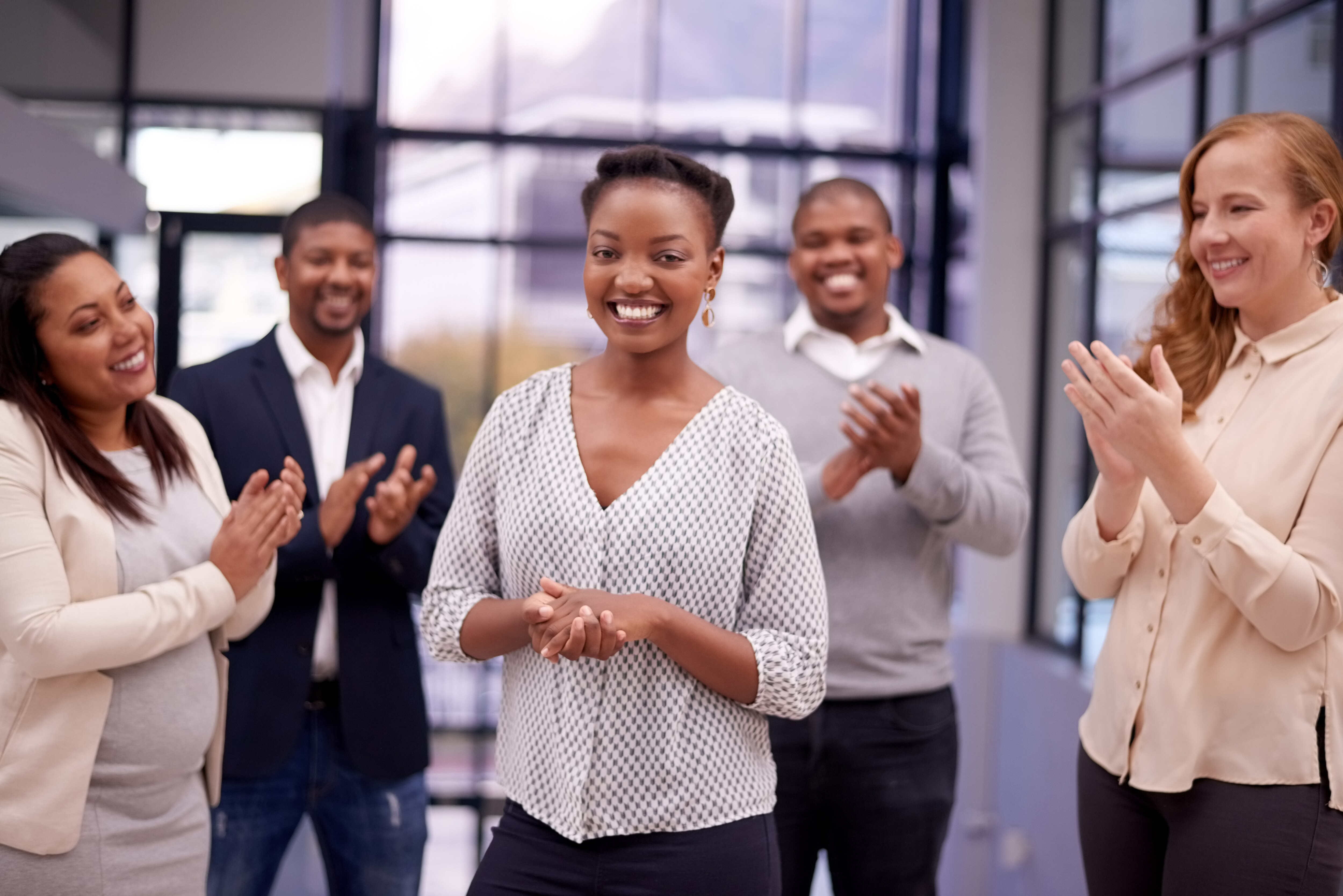 group applauds coworker