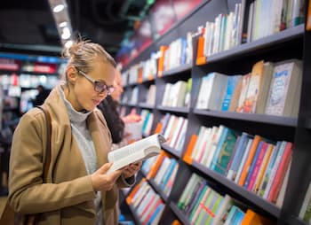 small business owner browses small business books at bookstore