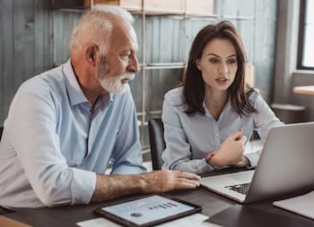 business partners review data for plan