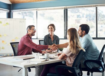 small business. owner welcomes new employee