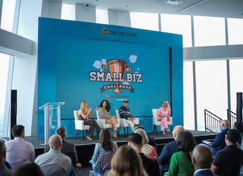 3 mentors sit on the Small Biz Challenge stage. 