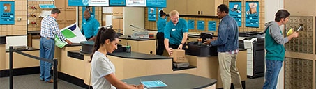 Numerous customers being helped inside The UPS Store