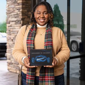An associate at The UPS Store packing and shipping a returned item