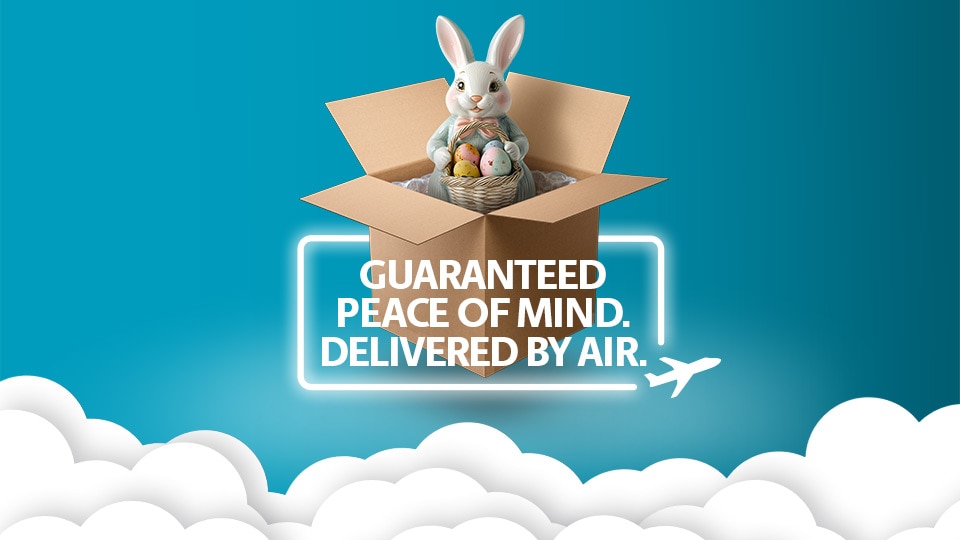 A bunny and colorful easter eggs inside of a The UPS Store box