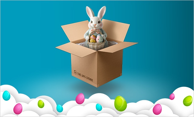 CAJA DE LA MARCA THE UPS STORE CON DECORACIÓN DE CONEJO DE PASCUA EN SU INTERIOR