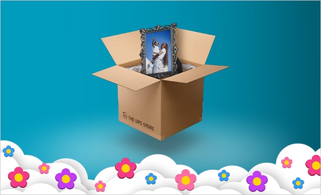 THE UPS STORE BRANDED BOX WITH PHOTO FRAME INSIDE. 