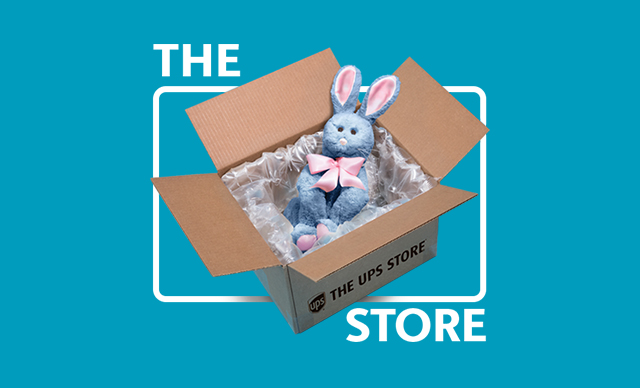Easter bunny inside of a The UPS Store box
