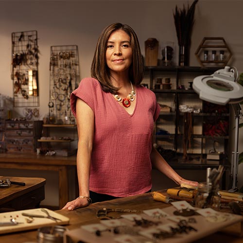 Portrait of a female entrepreneur standing in her shop