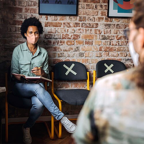 Job applicant wearing a mask in a job interview