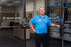 Associate receiving a fragile clock for shipment