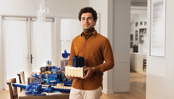 Man holding wrapped present